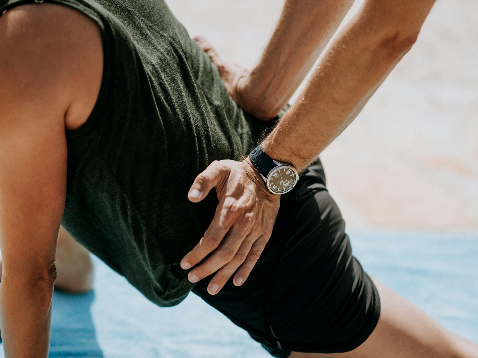 A therapist applies hands-on treatment to a man's back