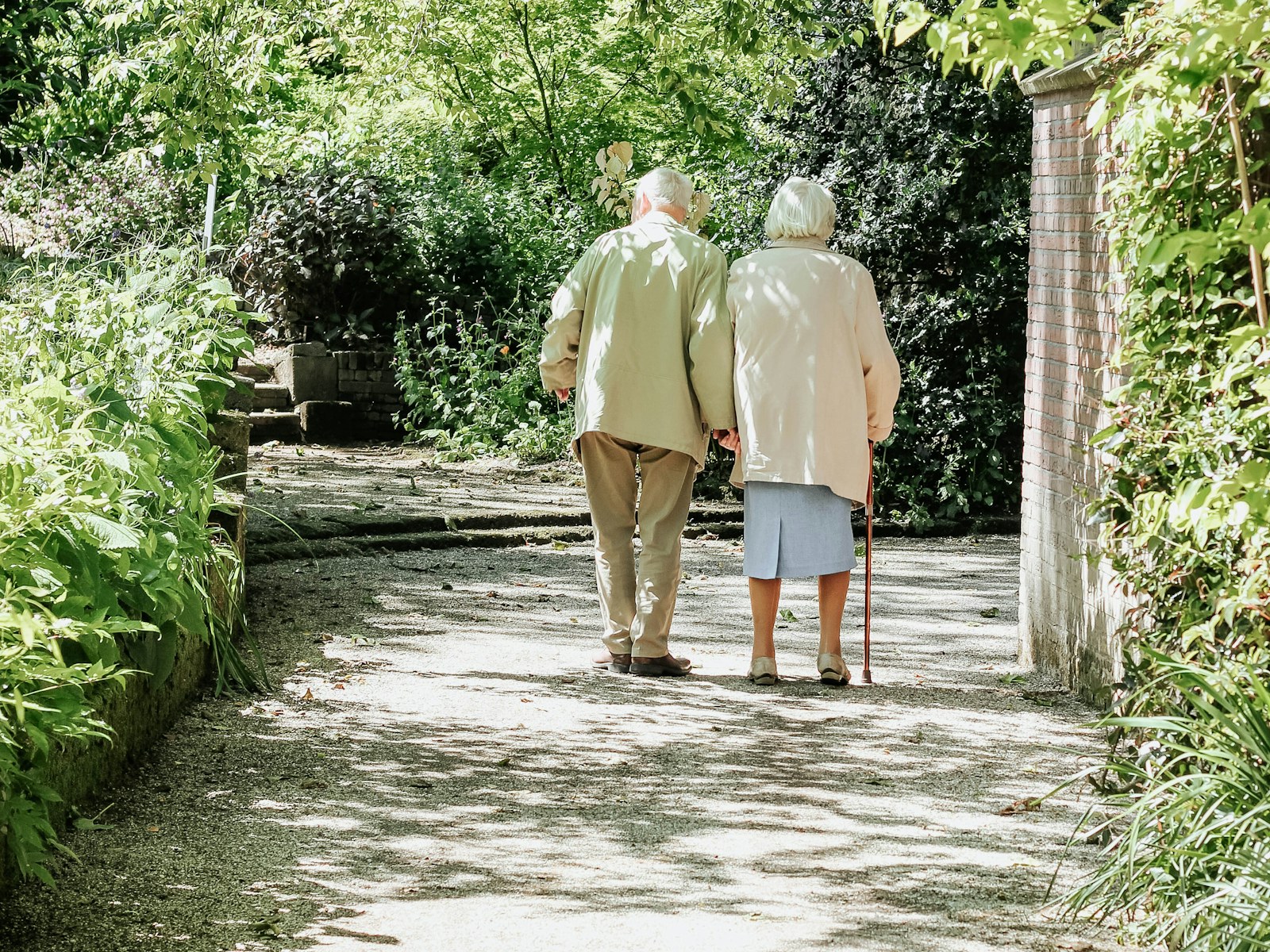 An older couple taking a walk outdoors
